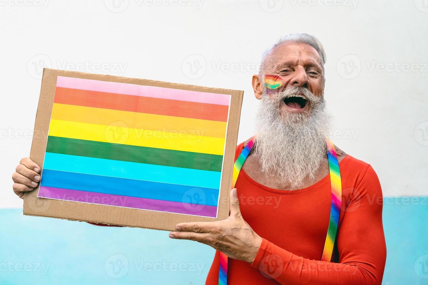 Happy senior man celebrating gay pride festival event - LGBT social movement concept photo