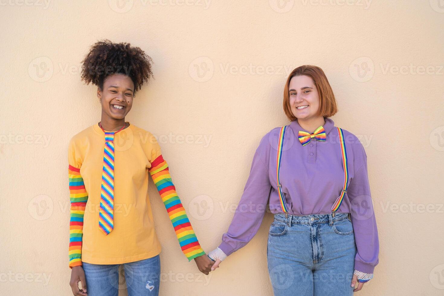 Happy women gay couple holding hands outdoor - Lgbt and love concept photo