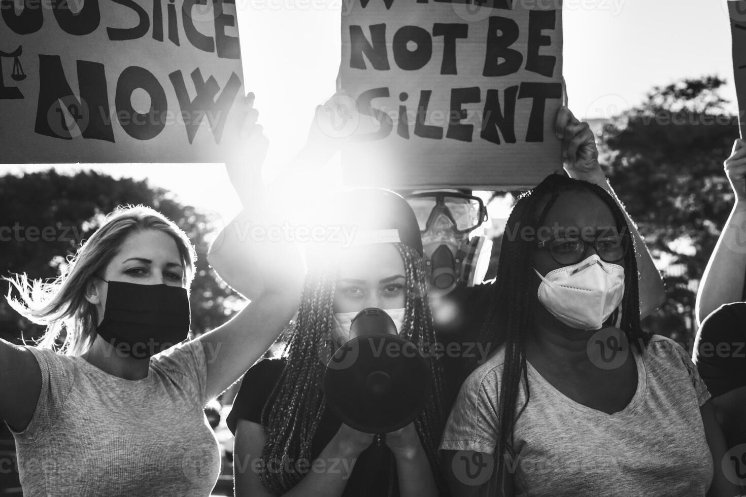 Black lives matter activist movement protesting against racism and fighting for equality - Demonstrators from different cultures and race protest on street for justice and equal rights photo