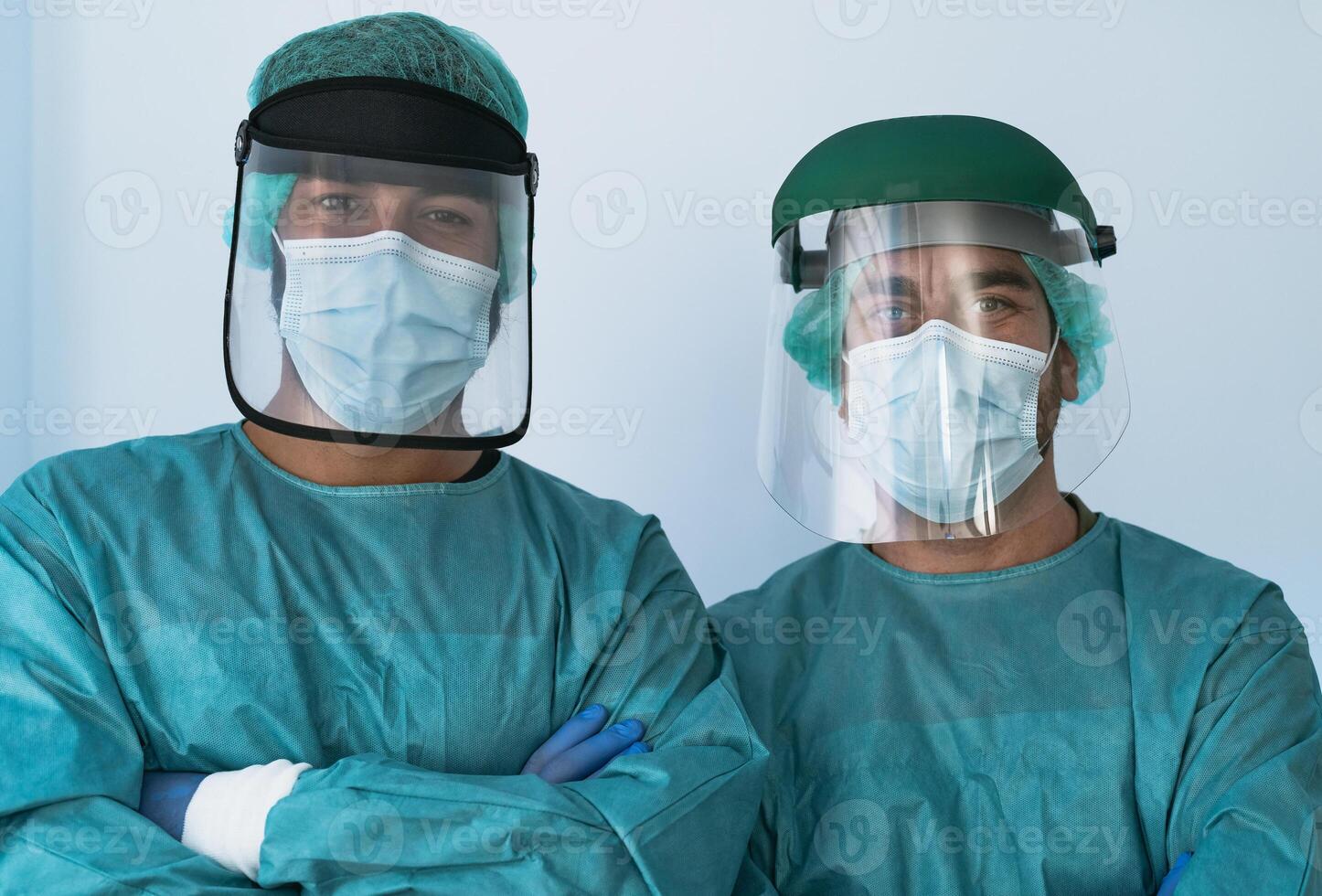 Doctors wearing personal protective equipment fighting against corona virus outbreak - Health care and medical workers concept photo