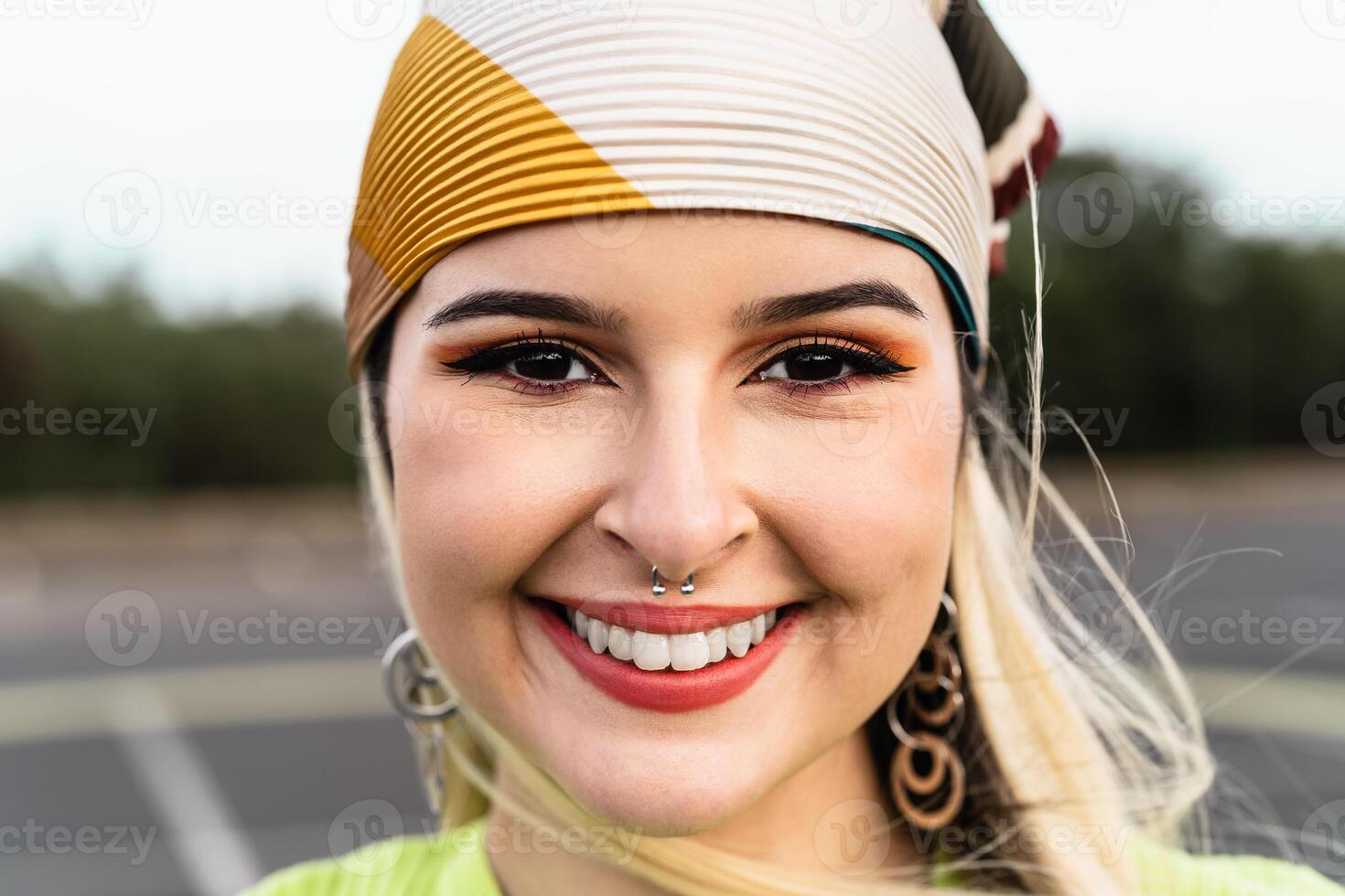 Portrait happy young girl while having fun hanging out photo