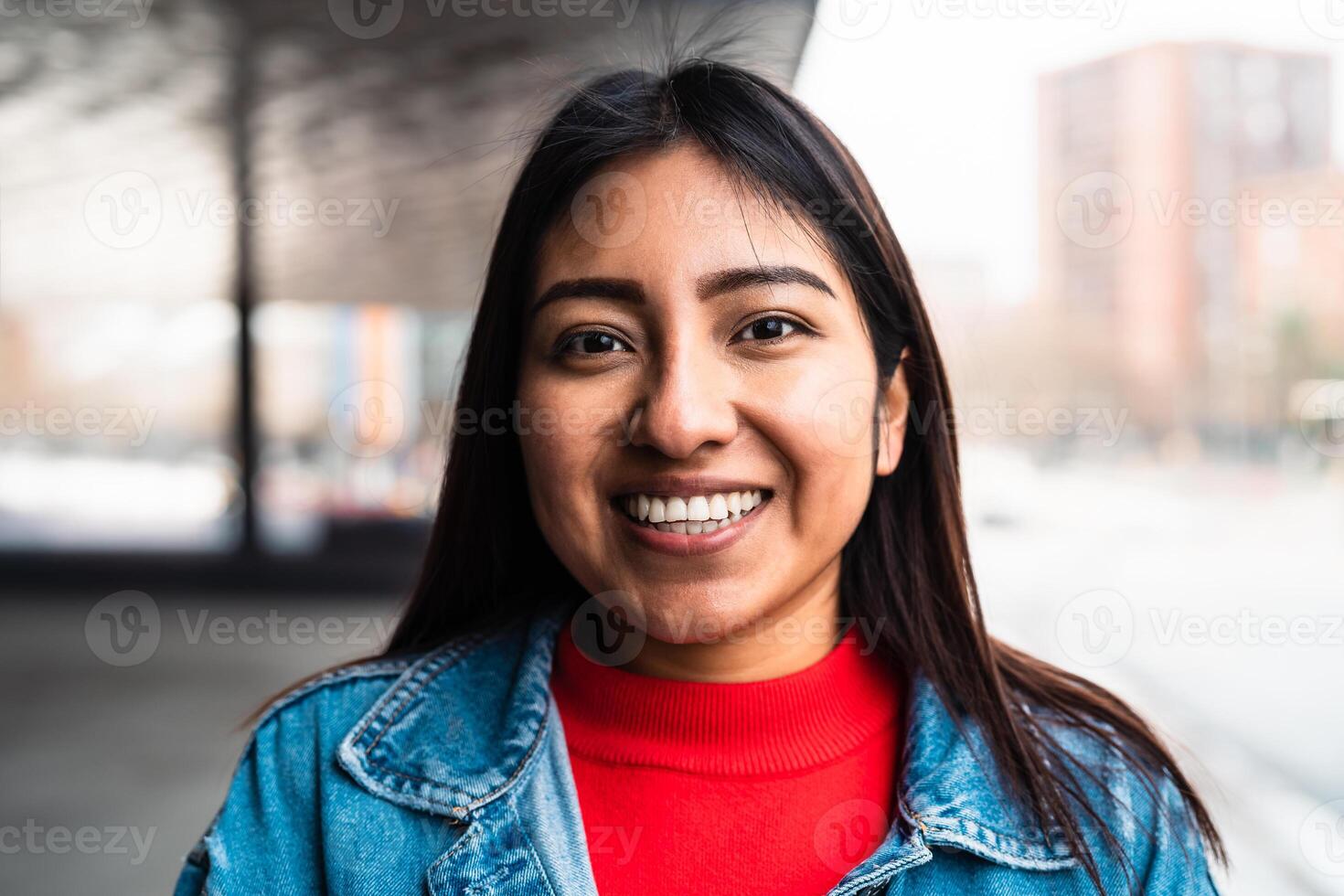 Happy native American young woman smiling in camera photo