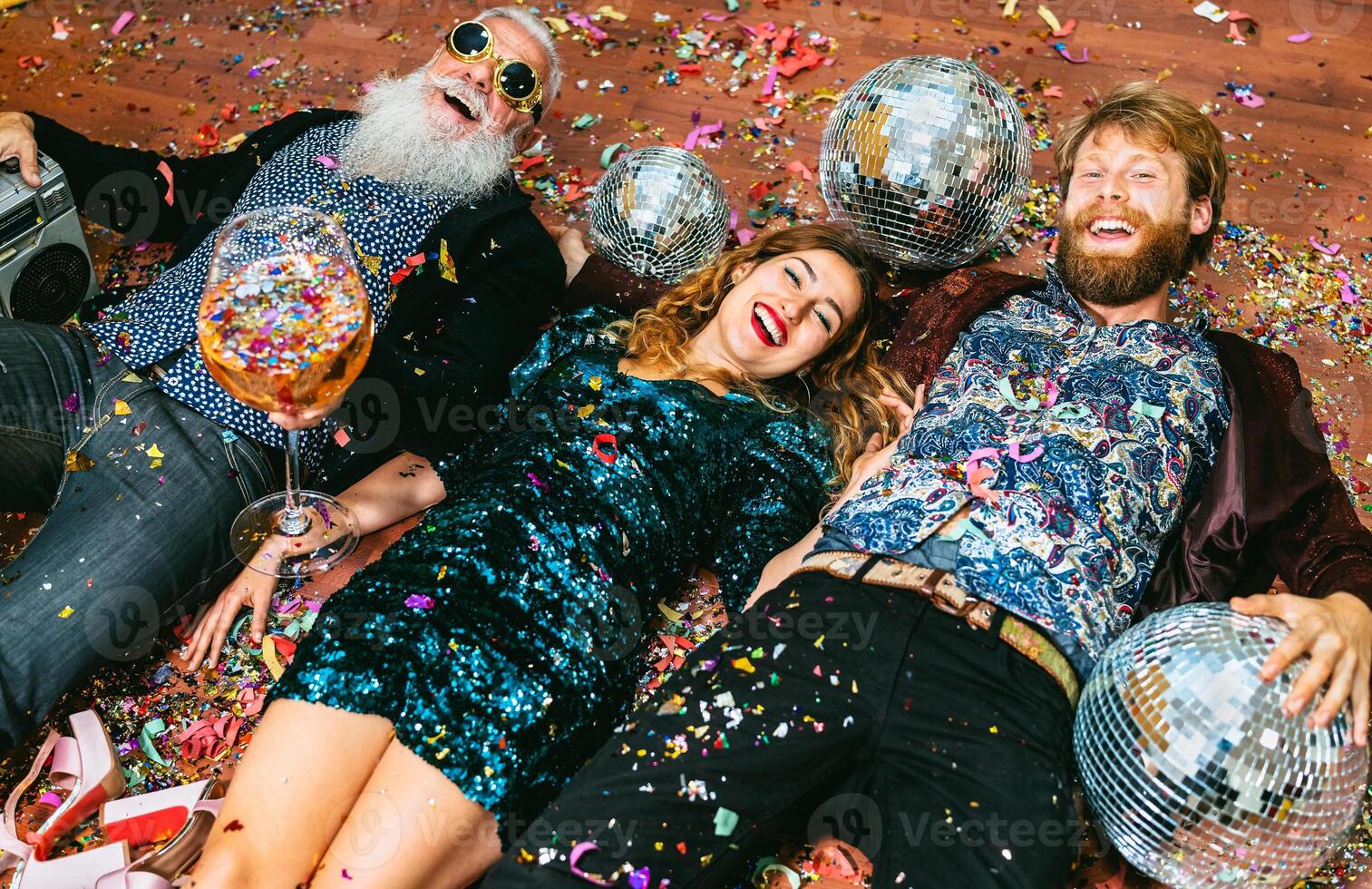 Happy party people with different age having fun celebrating holidays new year's eve photo