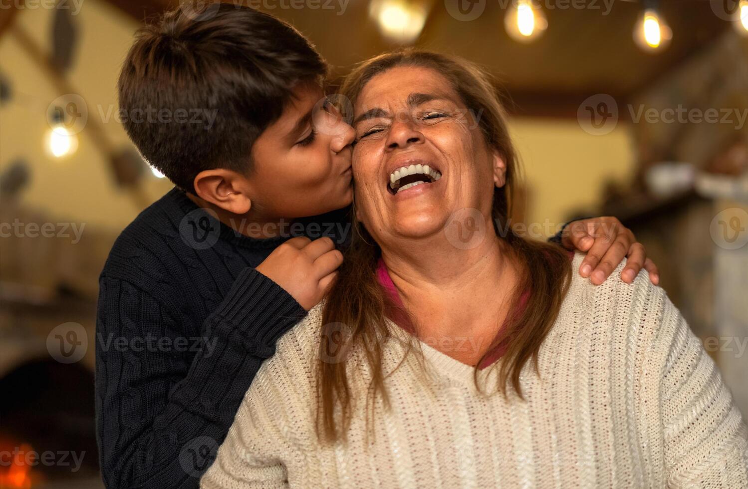 Happy smiling Hispanic grandmother and his grandchild having tender moment together - Family love and unity concept photo