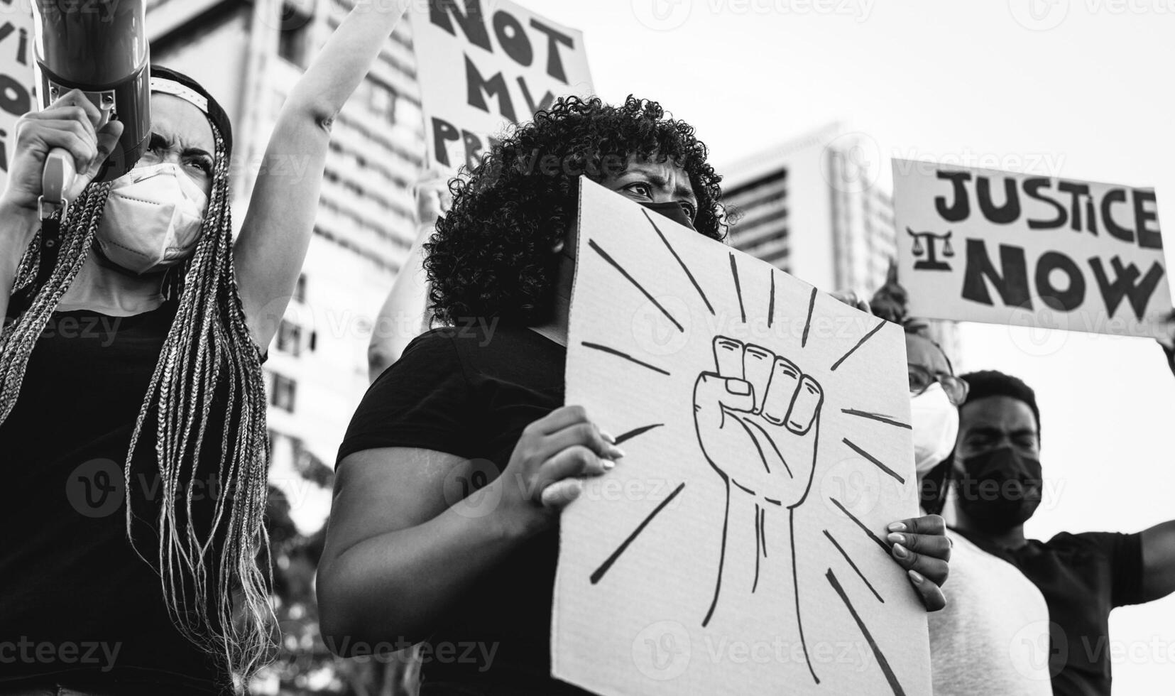 Black lives matter international activist movement protesting against racism and fighting for justice - Demonstrators from different cultures and race protest on street for equal rights photo