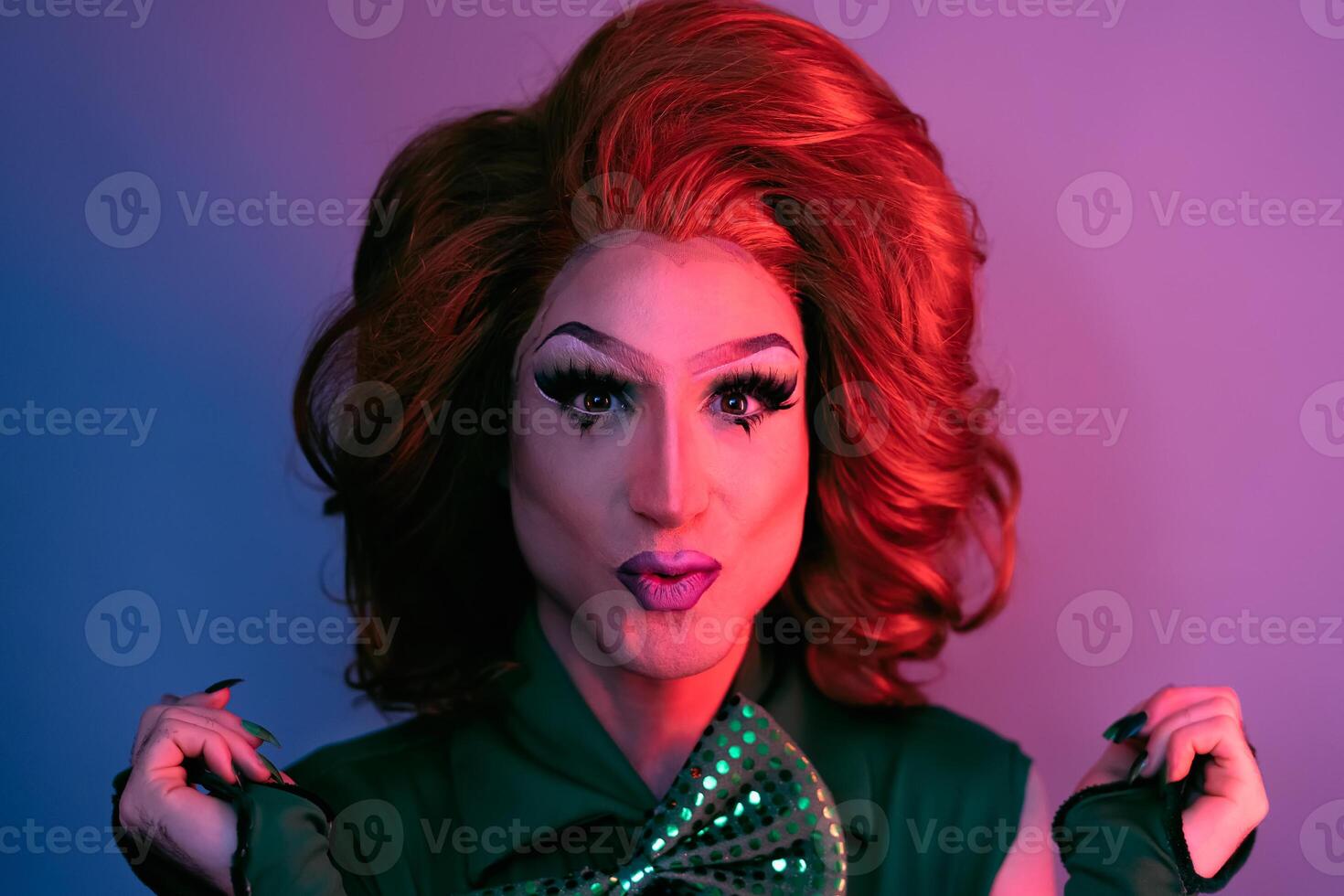 Portrait of drag queen on colored background looking into the camera photo