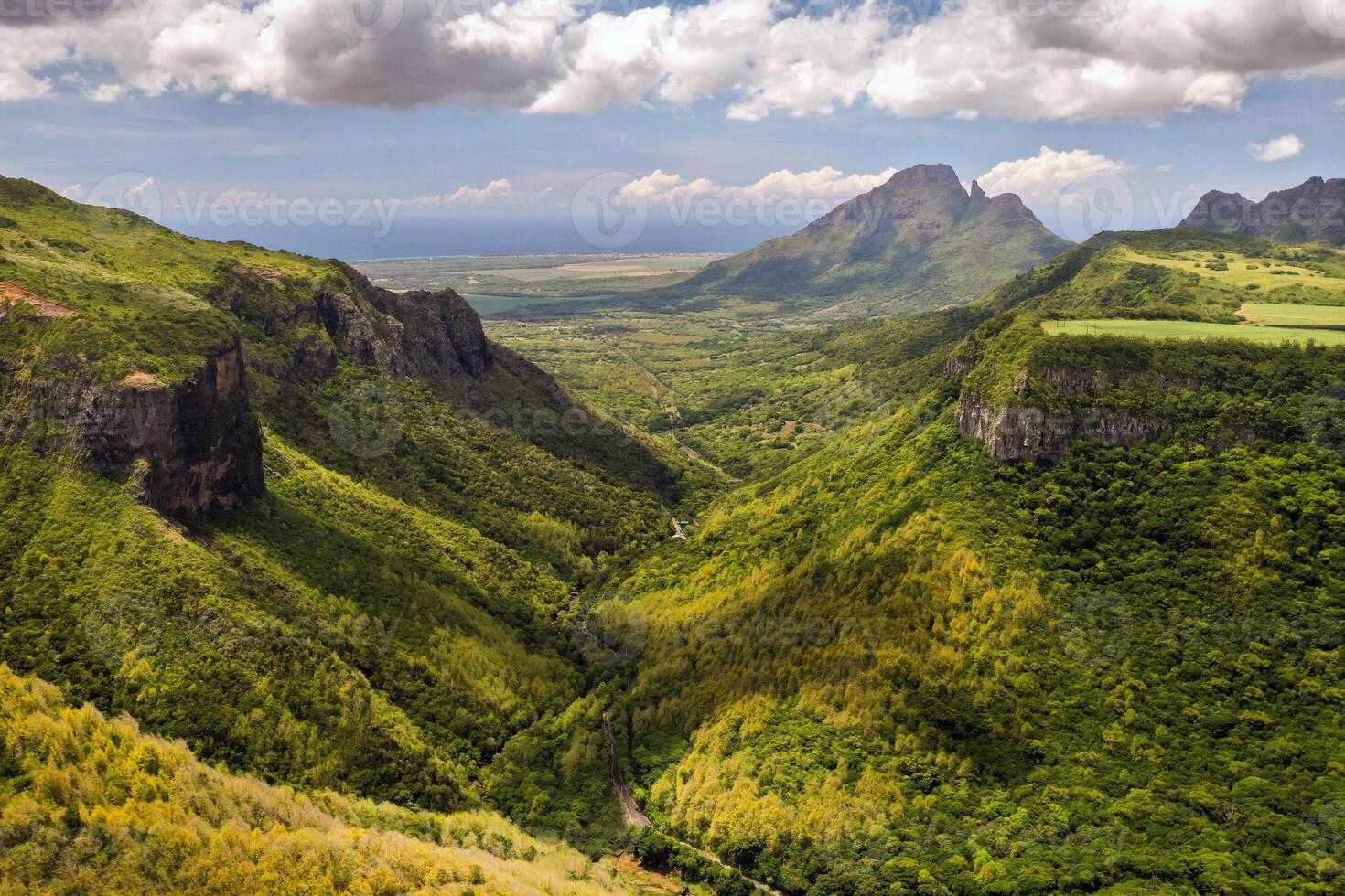 Mountain Landscape of the gorge on the island of Mauritius, Green mountains of the jungle of Mauritius photo