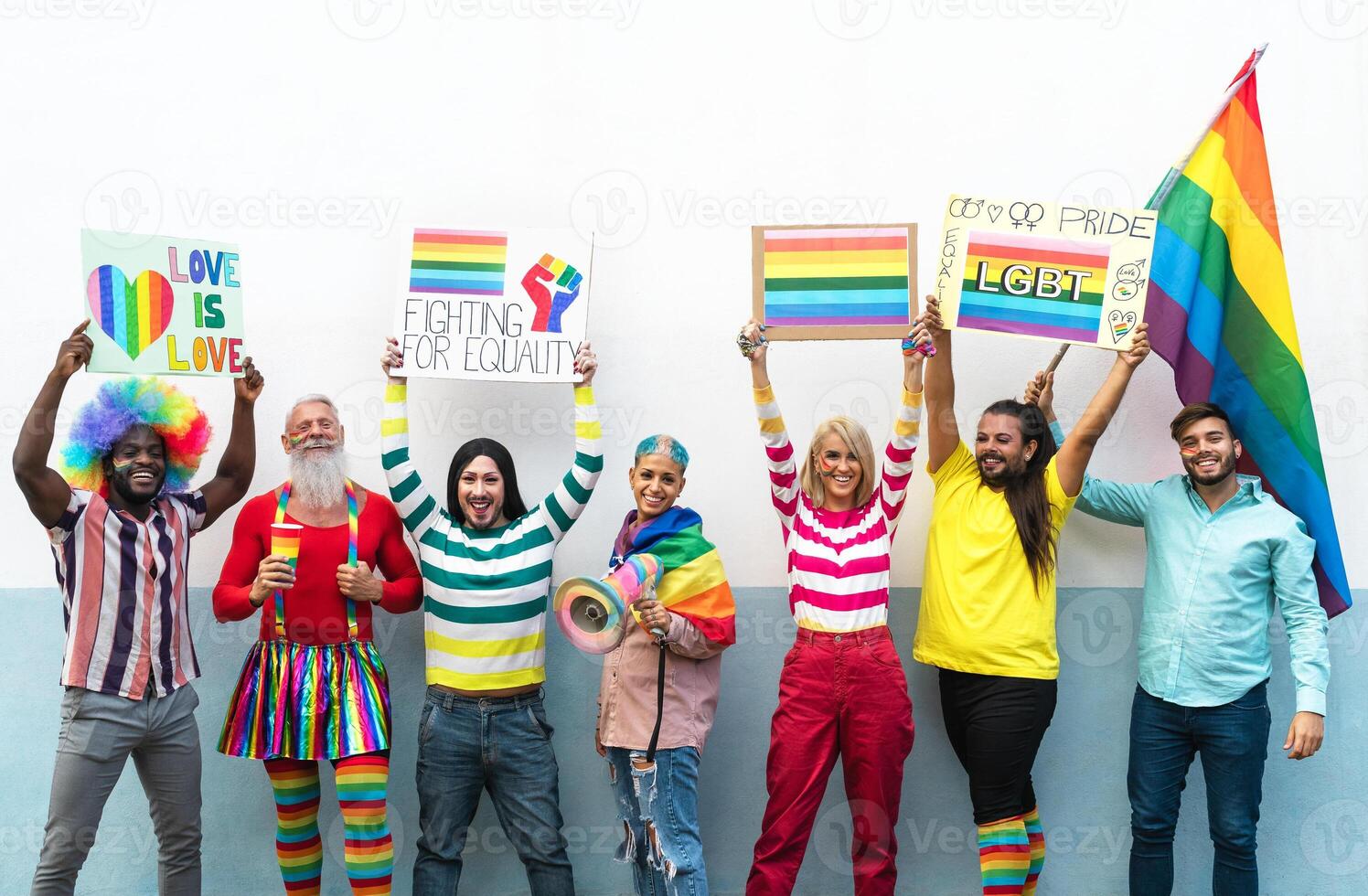 Happy Multiracial people celebrating gay pride event - Group of friends with different age and race having fun during LGBT social event photo