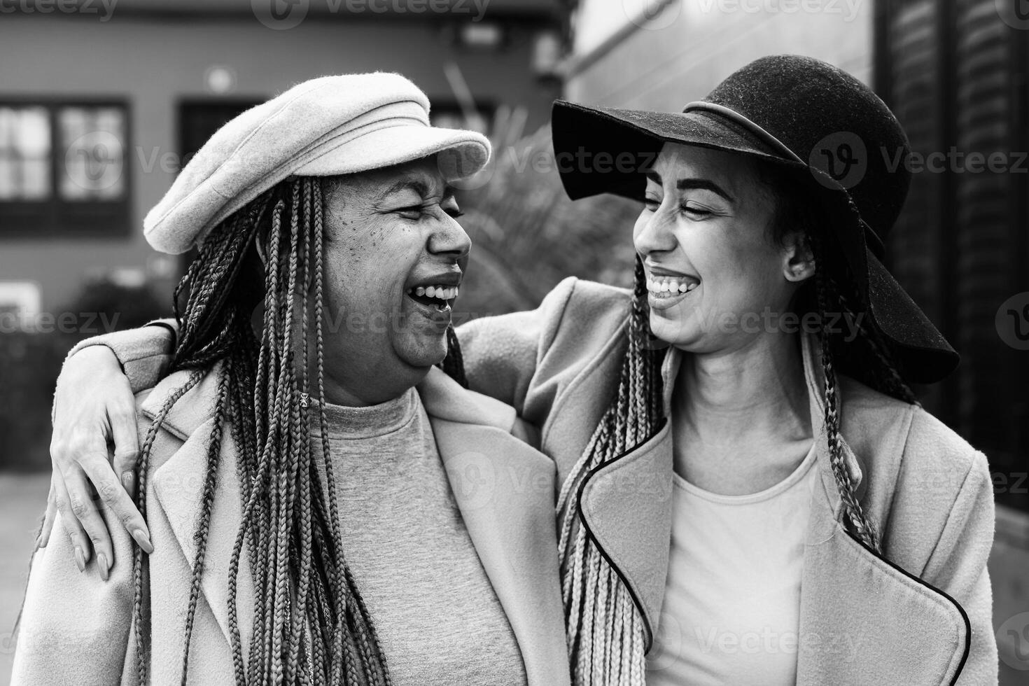 Happy African mother and daughter walking outdoor - Lovely family lifestyle concept - Black and white editing photo