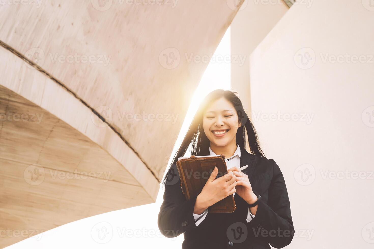 Asian business woman using smart tablet out office - Young smiling Chinese girl ready for working on digital marketing - Technology apprenticeship and entrepreneurship professional job concept photo