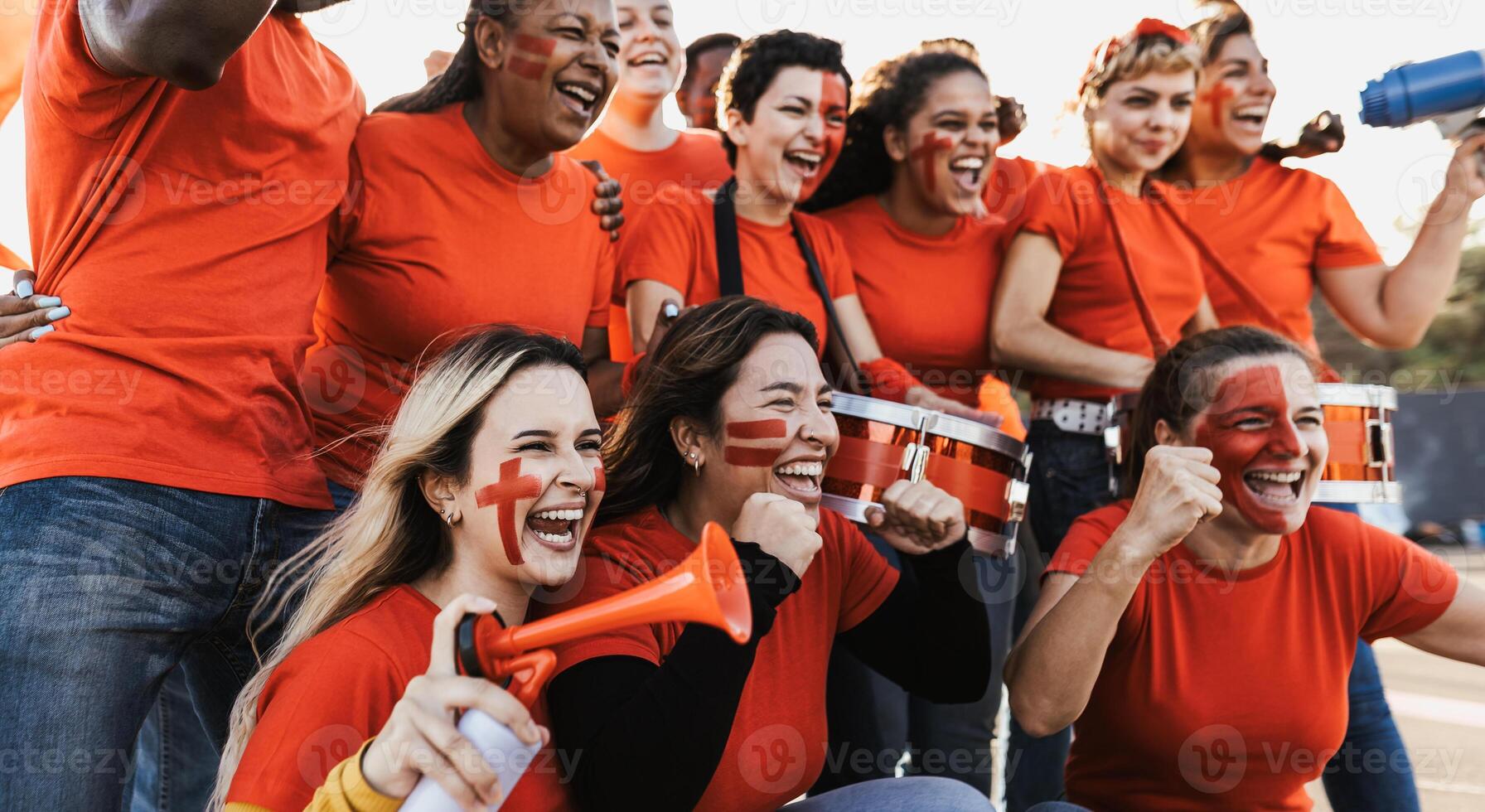 Red Football fans cheering for their favorite team - Soccer sport entertainment concept photo