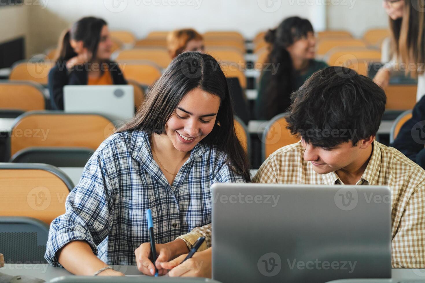 Young people studying inside university classroom - School education concept photo