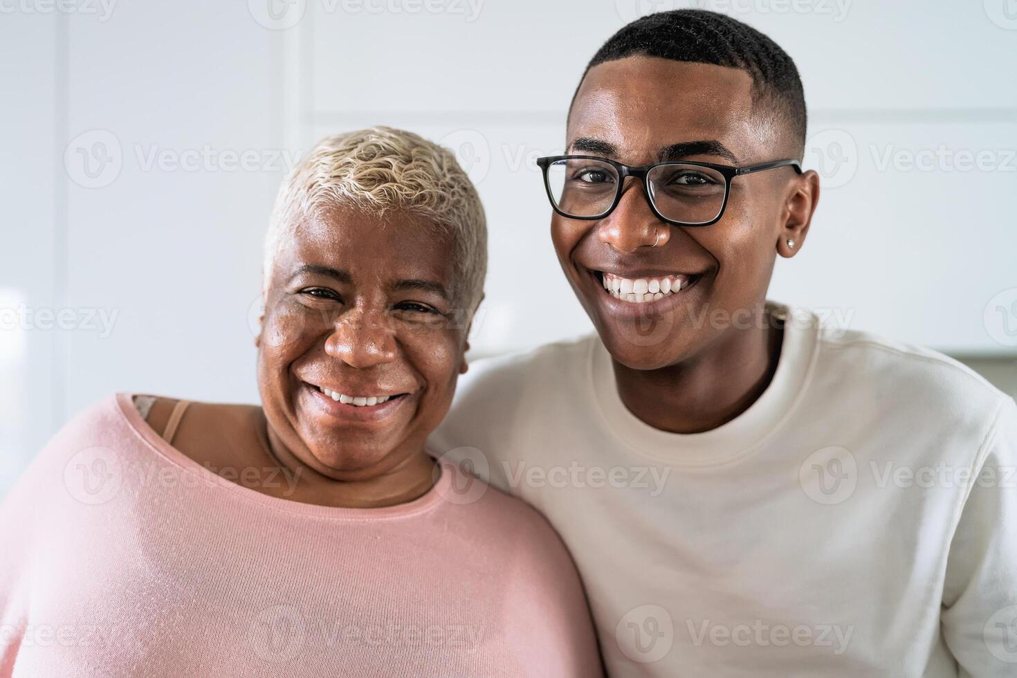 Happy smiling Hispanic mother and son portrait - Family love and unity concept photo