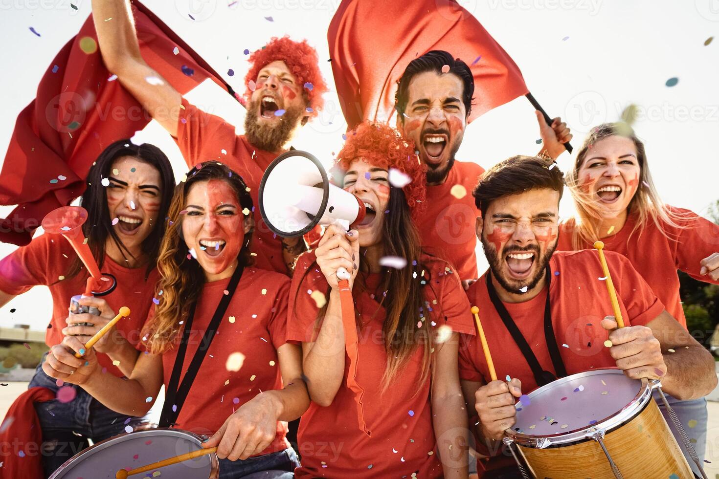 Football fans having fun cheering their favorite team - Soccer sport entertainment concept photo