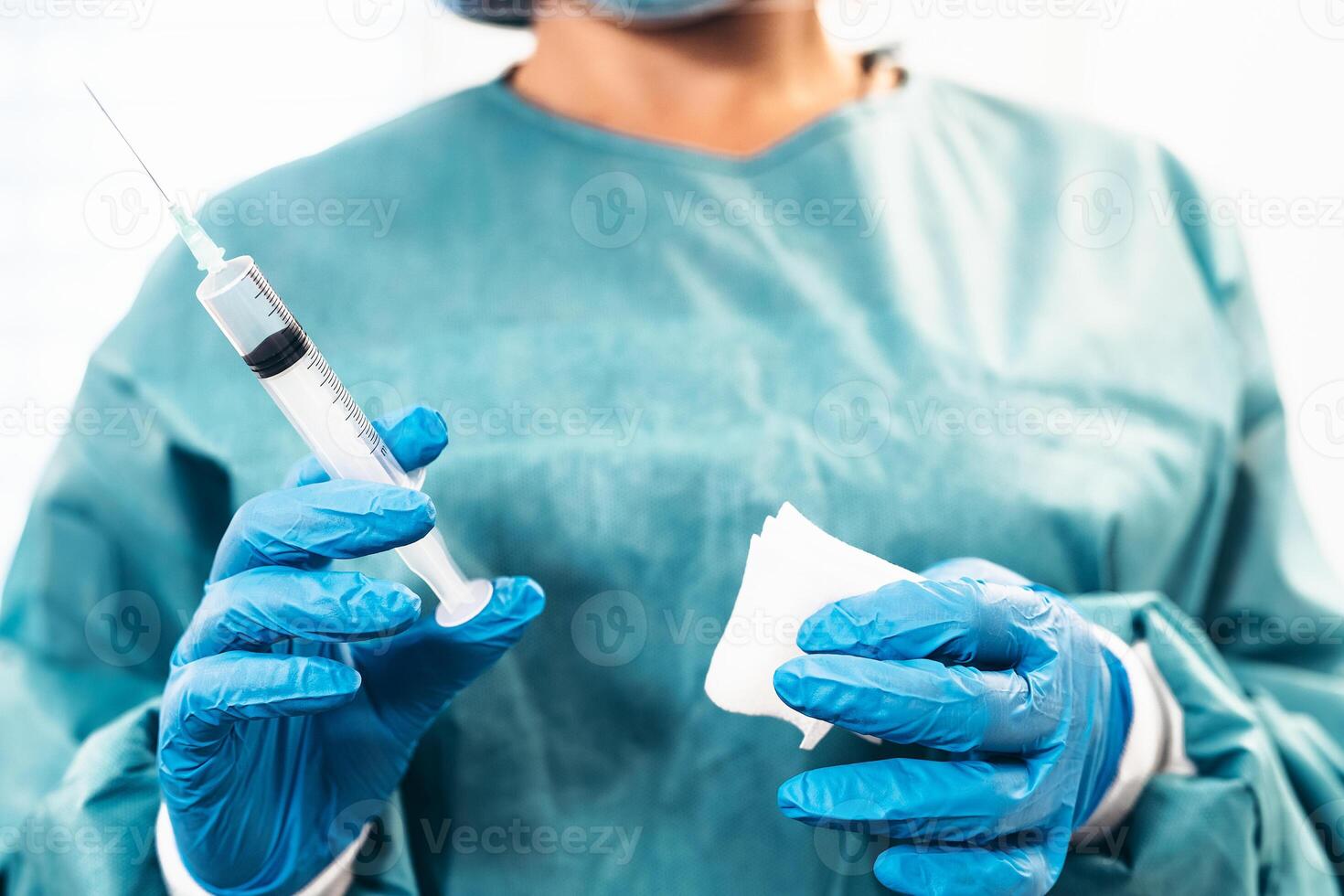 Close up woman doctor with syringe vaccine in hospital for preventing a stop corona virus outbreak - Healthcare medicine and medical cure against pandemic concept photo