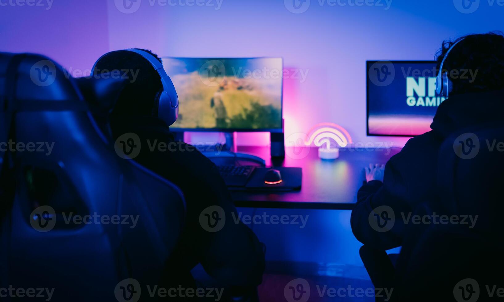 Young gamers having fun playing on decentralized NFT gaming blockchain platform at home - Gaming entertainment and new technology concept photo