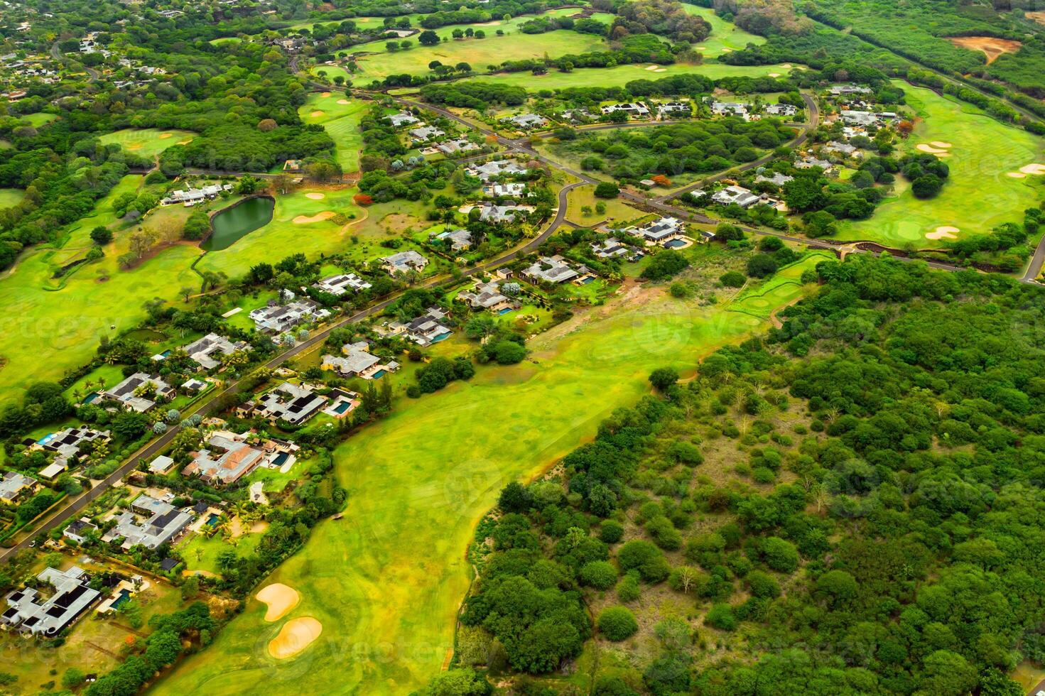 A bird's-eye view of the town and Golf courses on the island of Mauritius.Villas on the island of Mauritius.Golf course photo