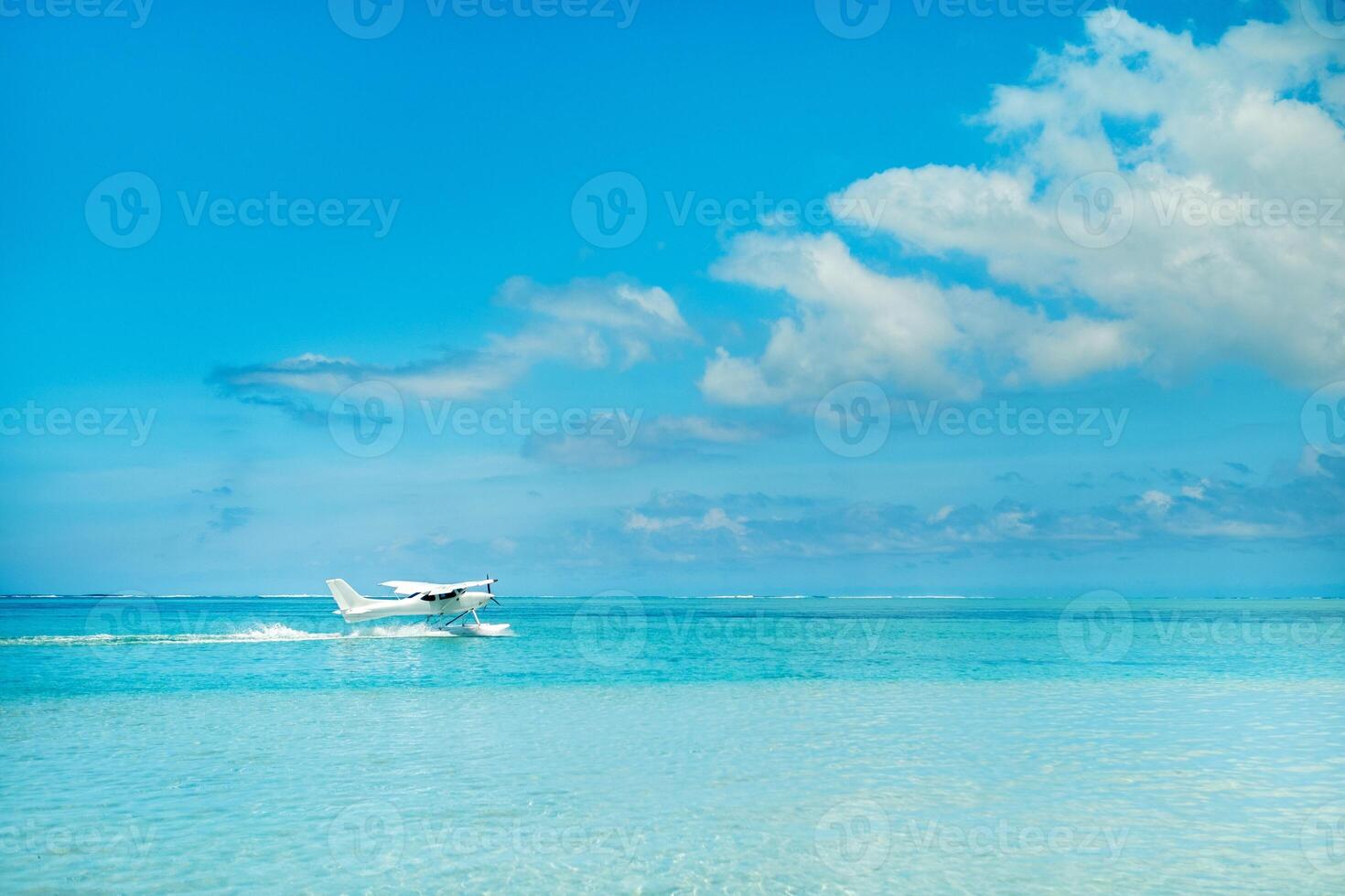 Seaplane begins to take off on the island of Mauritius in the Indian Ocean photo