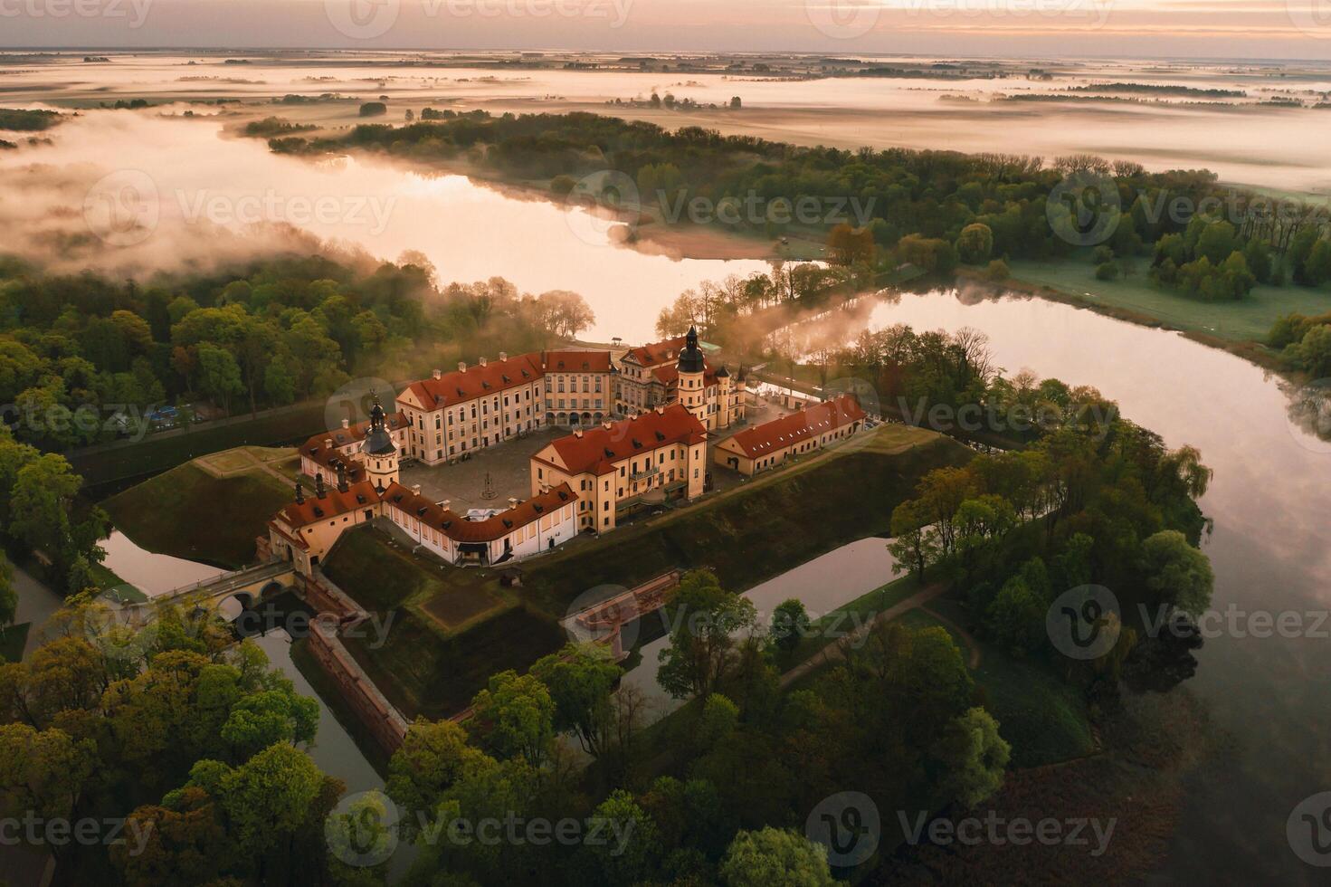 Nesvizh castle is a residential castle of the Radziwill family in Nesvizh, Belarus, with a beautiful view from above at dawn photo