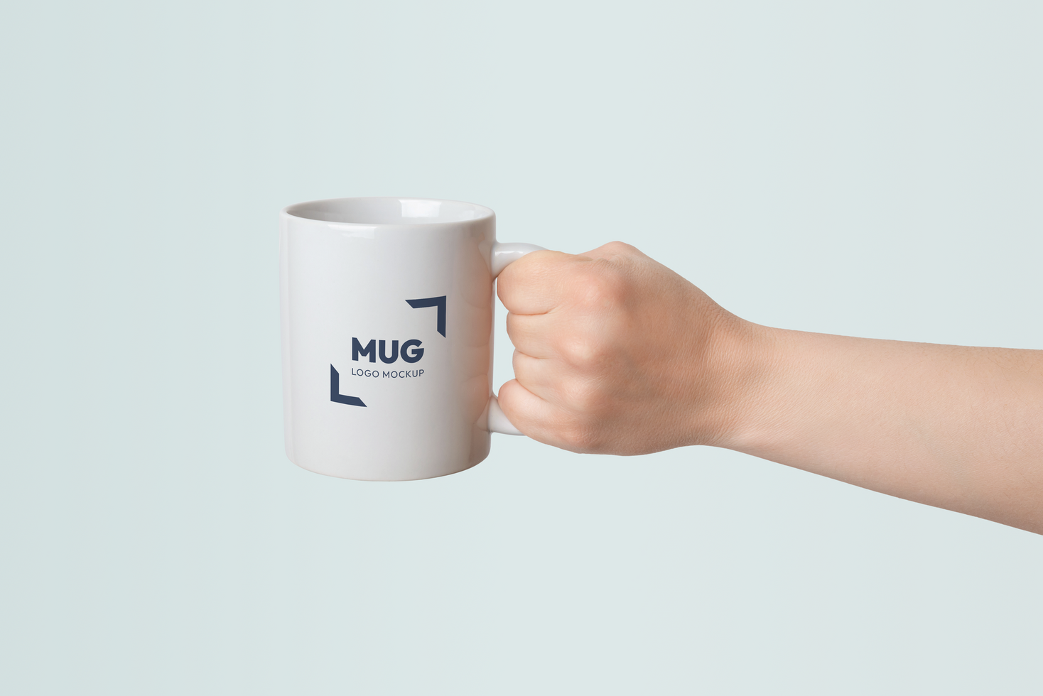 White mug held in hand with logo branding mockup and interchangeable background psd