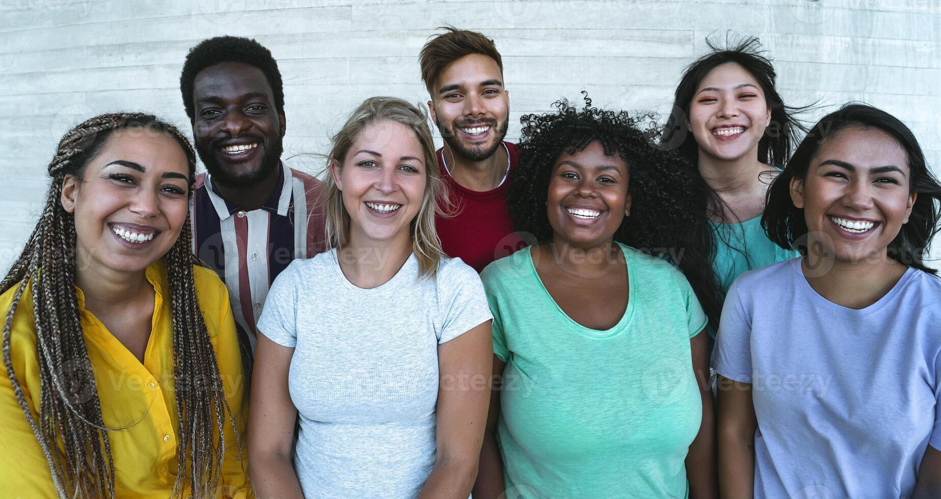 Group multiracial friends having fun outdoor - Young people from different culture and race - Diversity and youth millennial generation concept photo