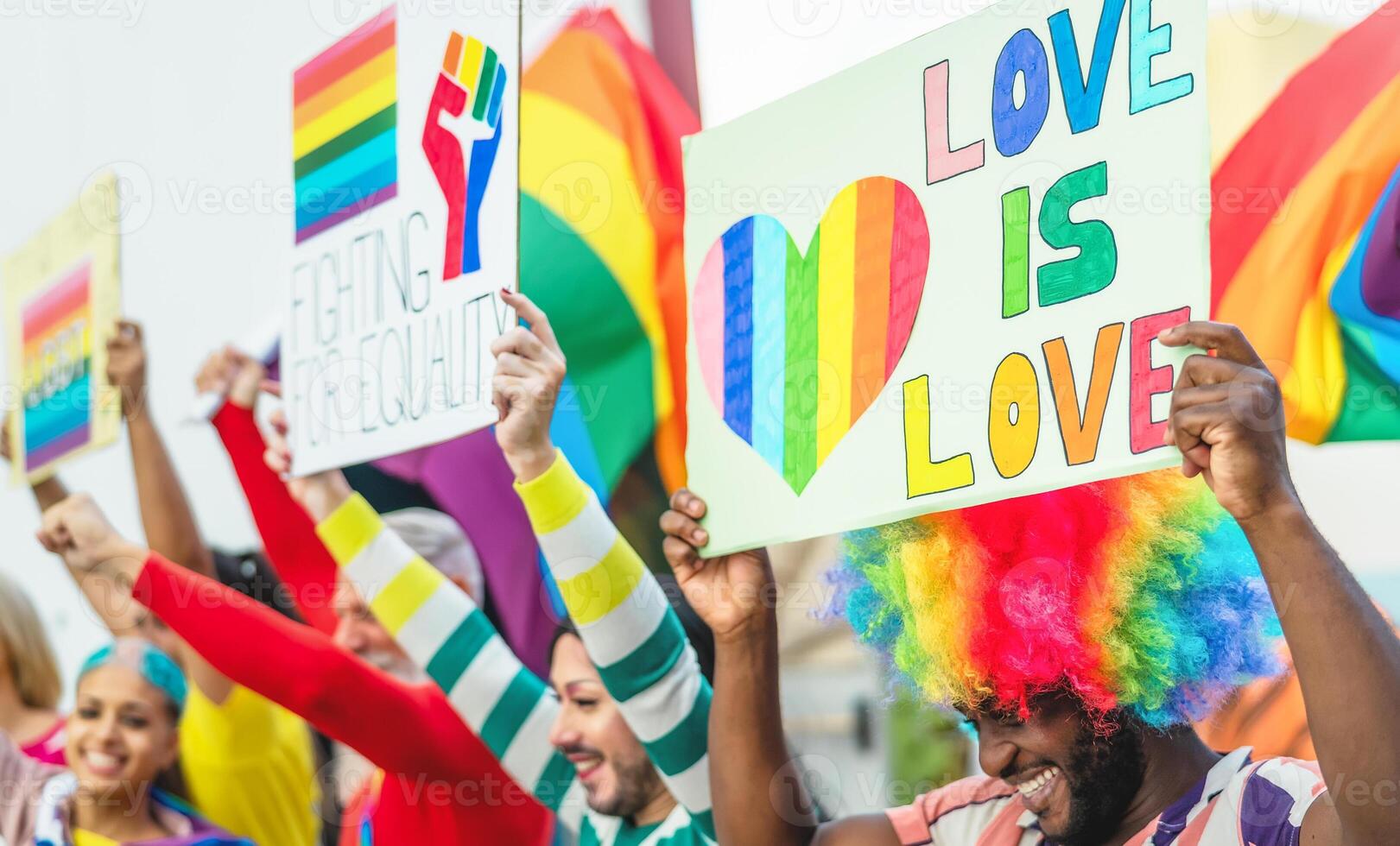 Happy Multiracial people celebrating gay pride event - Group of friends with different age and race having fun during LGBT social event photo