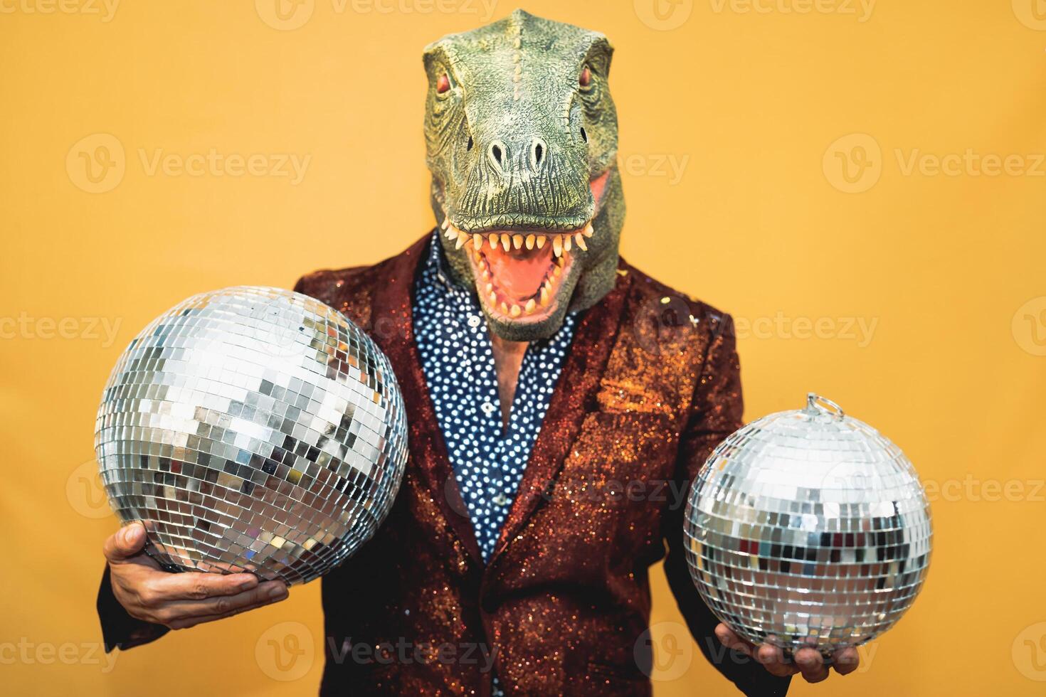 Fashion senior man wearing t-rex dinosaur mask while celebrating carnival holidays - Surreal masking concept photo