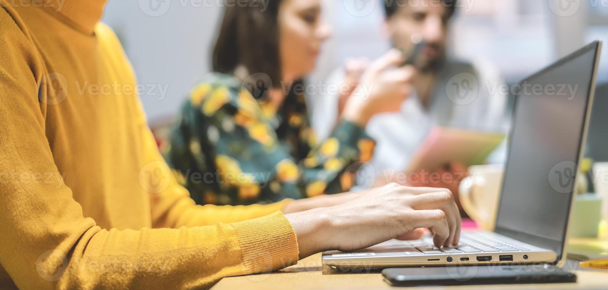 Young friends working together inside office - Millennial people doing startup strategy in coworking space - Youth co-workers millennials generation and technology workspace concept photo