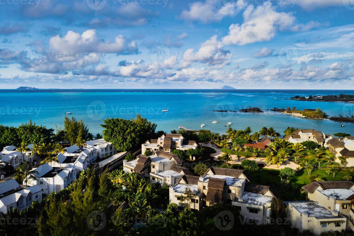 Aerial photography of a coral reef and a hotel complex with beaches in Mauritius, the North-East coast of the island of Mauritius. Beautiful lagoon of the island of Mauritius, taken from above. photo