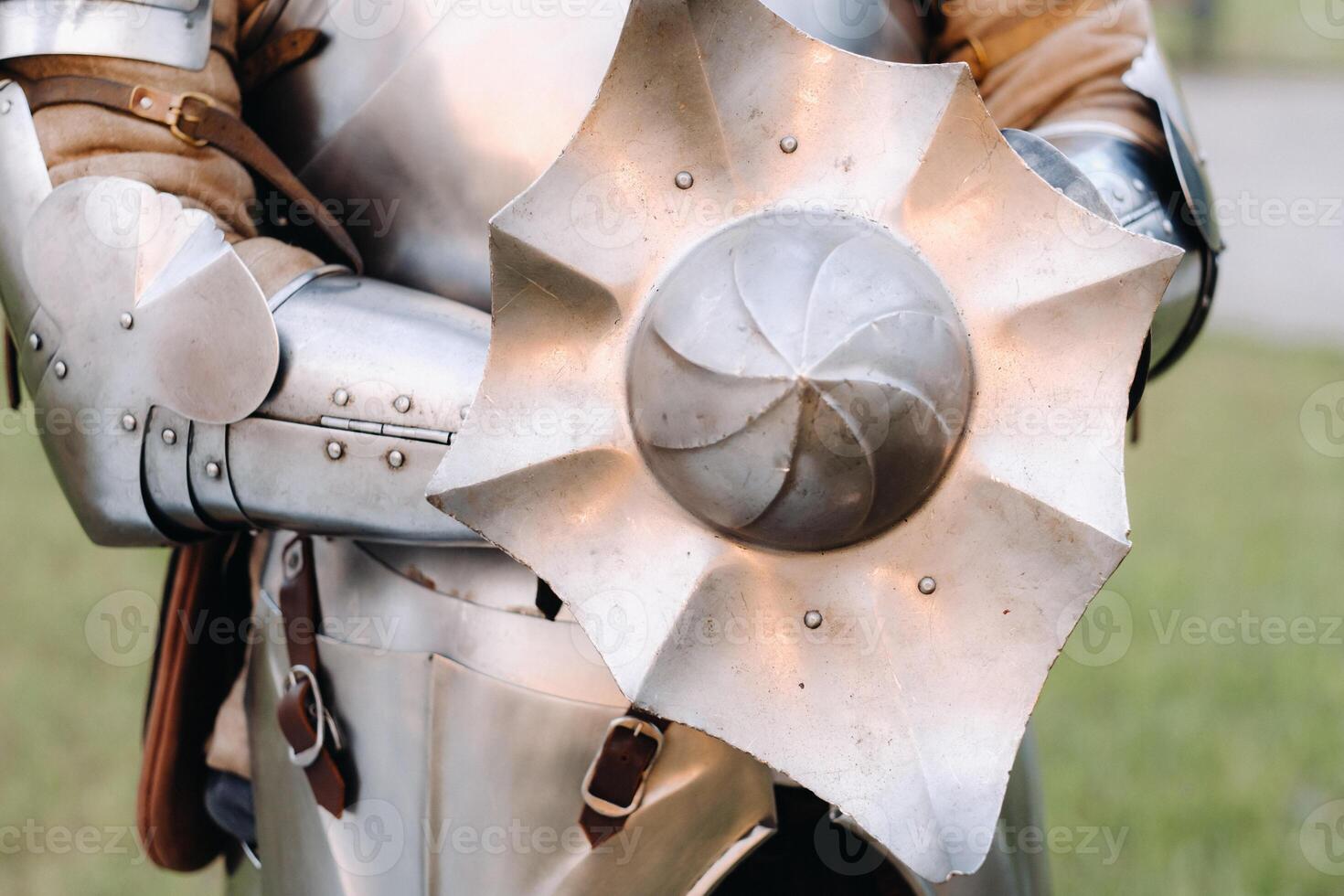 An ancient shield of ancient knight's armor.A medieval concept.Metallic texture photo