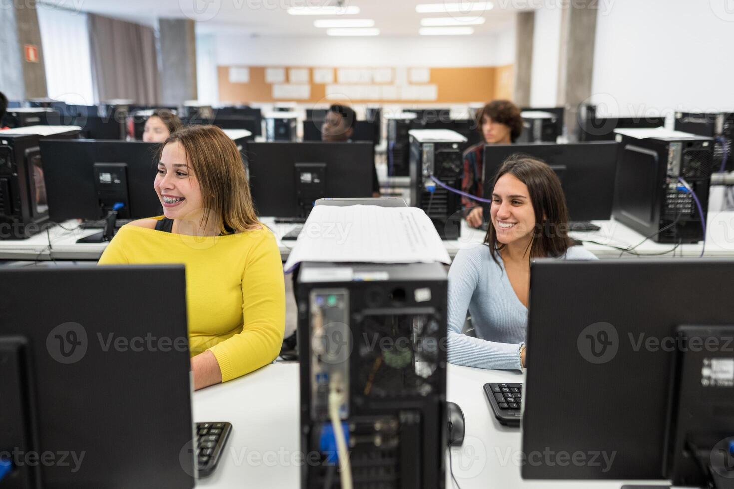 Young students listening a lecture  inside university classroom - Education concept photo