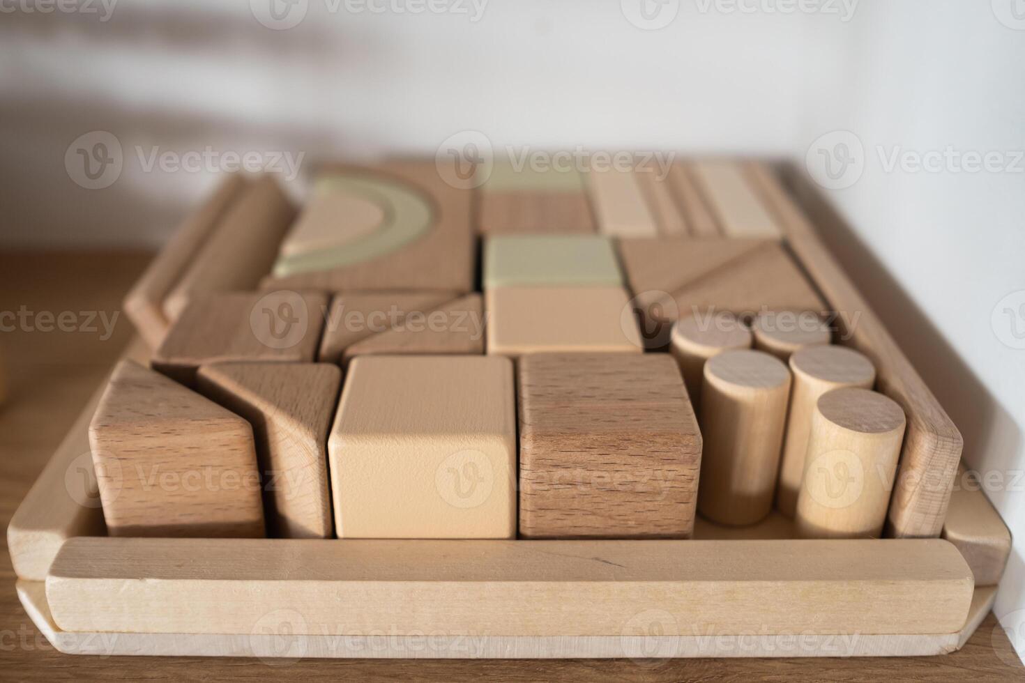 A shelf with children's wooden toys in the children's room. Children's concept photo