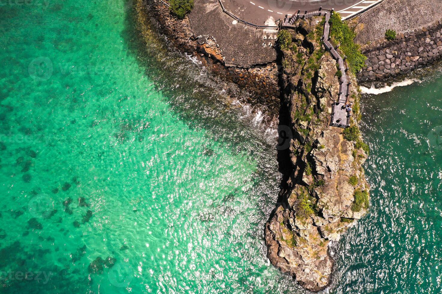 Maconde view point.Monument to captain Matthew Flinders in Mauritius. An unusual road to the Islands of Mauritius. Coral reef in the Indian ocean photo
