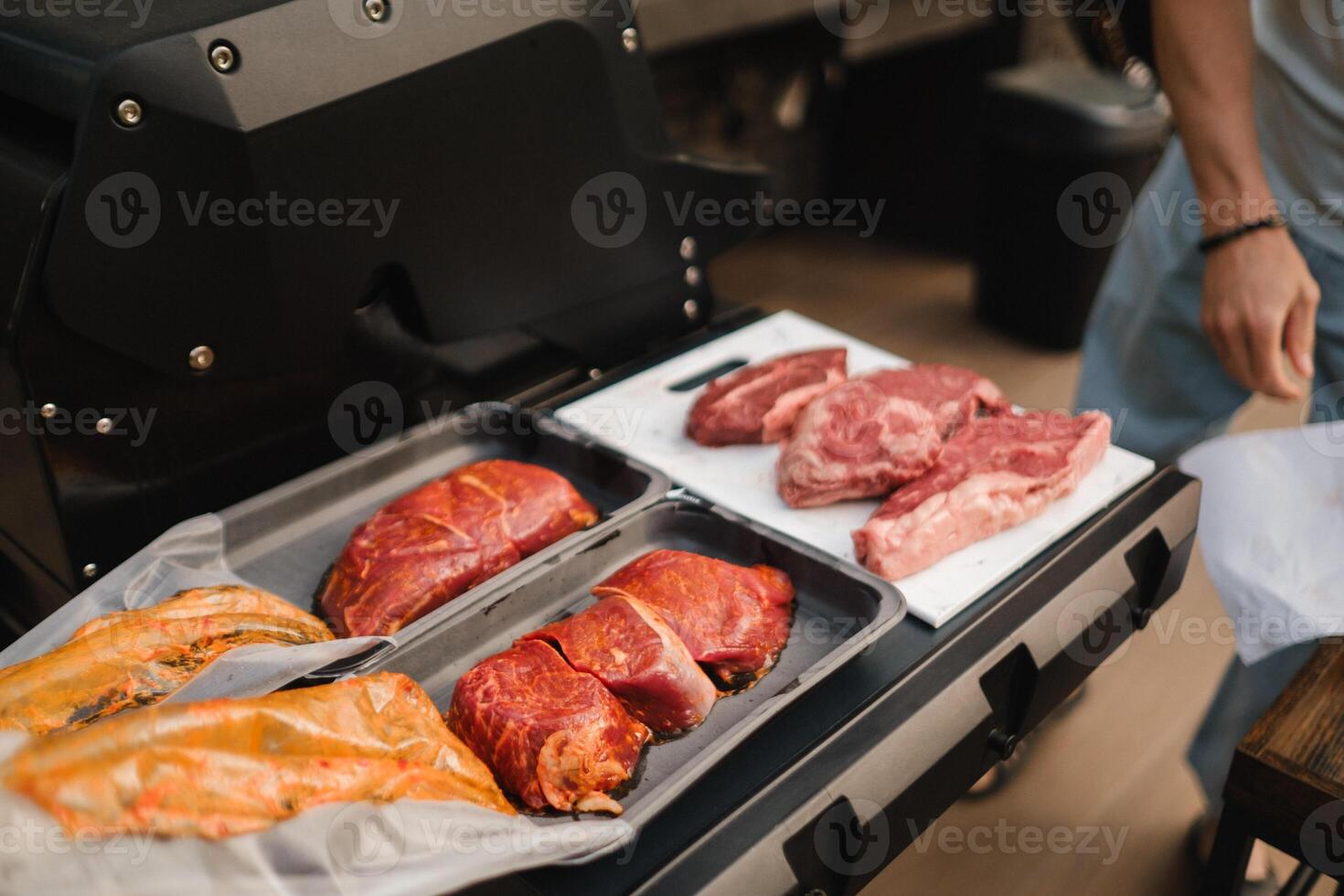 Preparation for cooking meat on an open grill photo