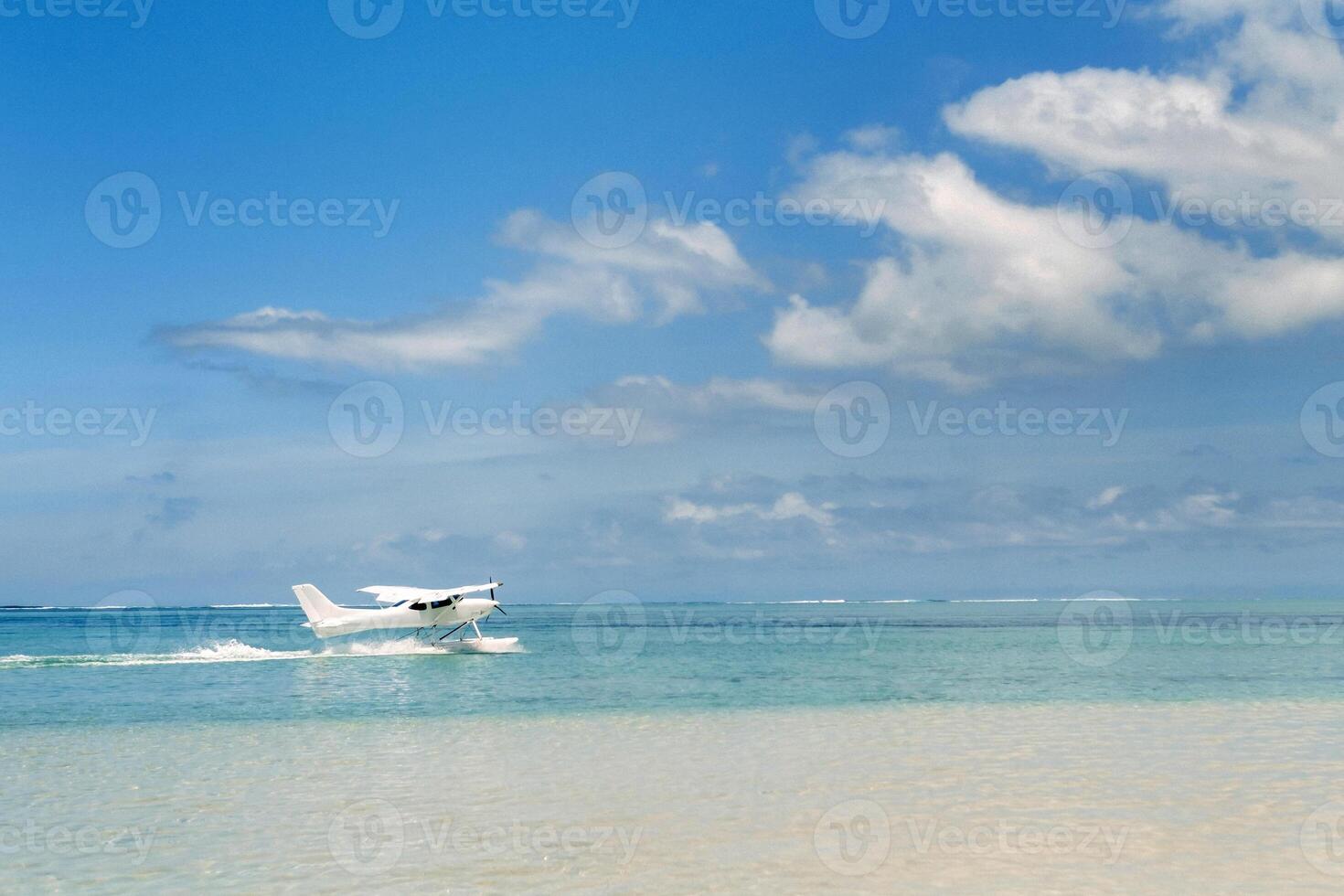 Seaplane begins to take off on the island of Mauritius in the Indian Ocean photo