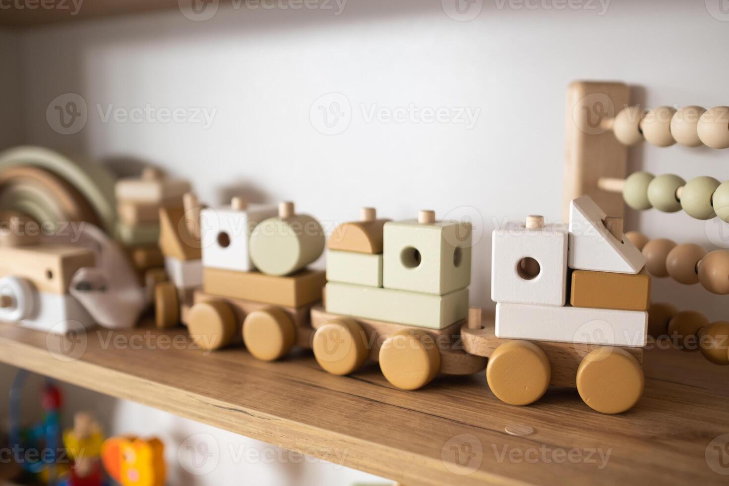 A shelf with children's wooden toys in the children's room. Children's concept photo