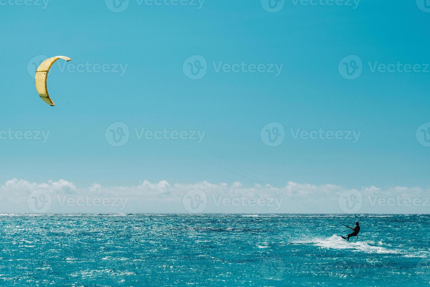 A man paragliding on Le Morne beach, Mauritius, Indian ocean on the island of Mauritius photo