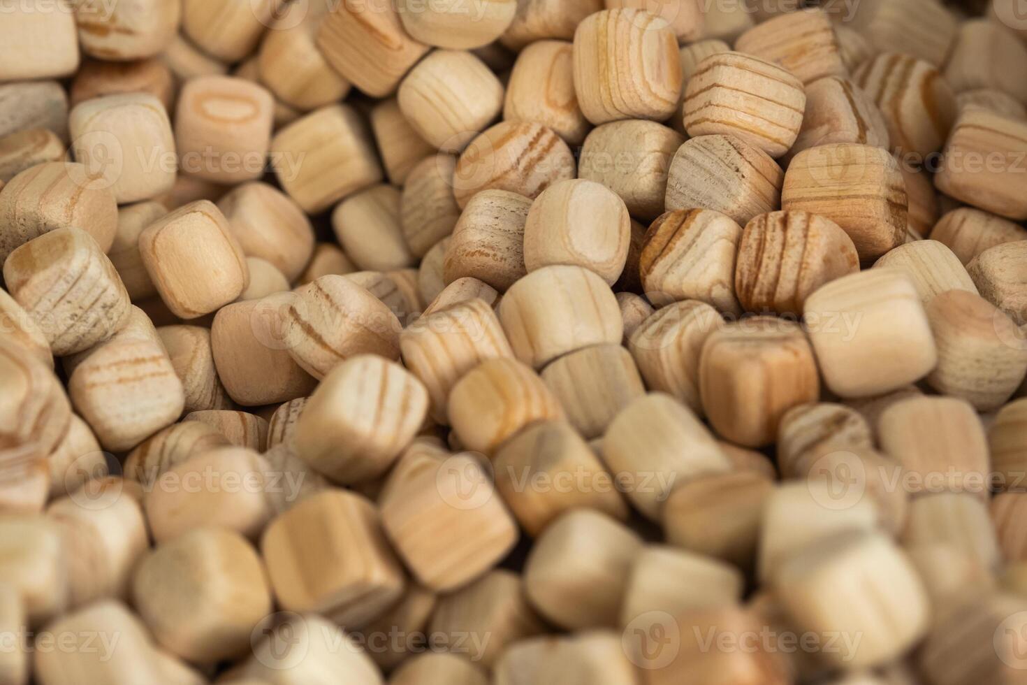 Lots of small wooden cubes. Background of wooden cubes photo