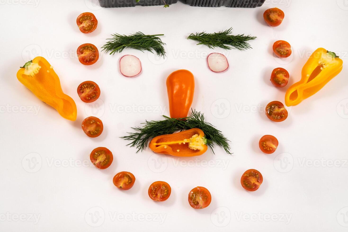 A person s face made of vegetables on a white background photo