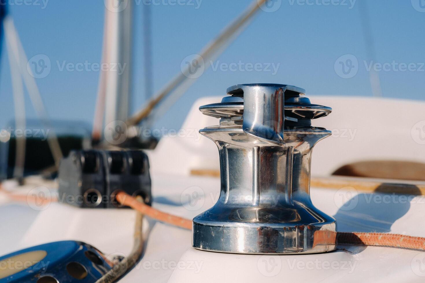 rope on the winch of a white yacht in the sea.yacht equipment photo