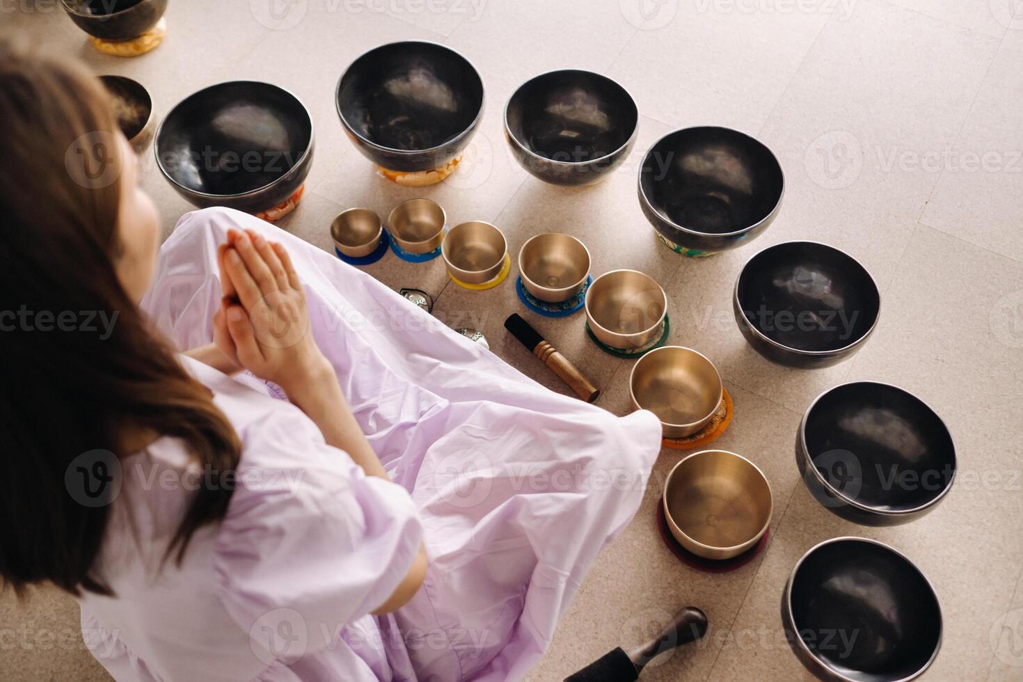 Tibetan singing bowl in your hands - Translation of mantras transform your impure body, speech and mind into a pure exalted body, speech photo