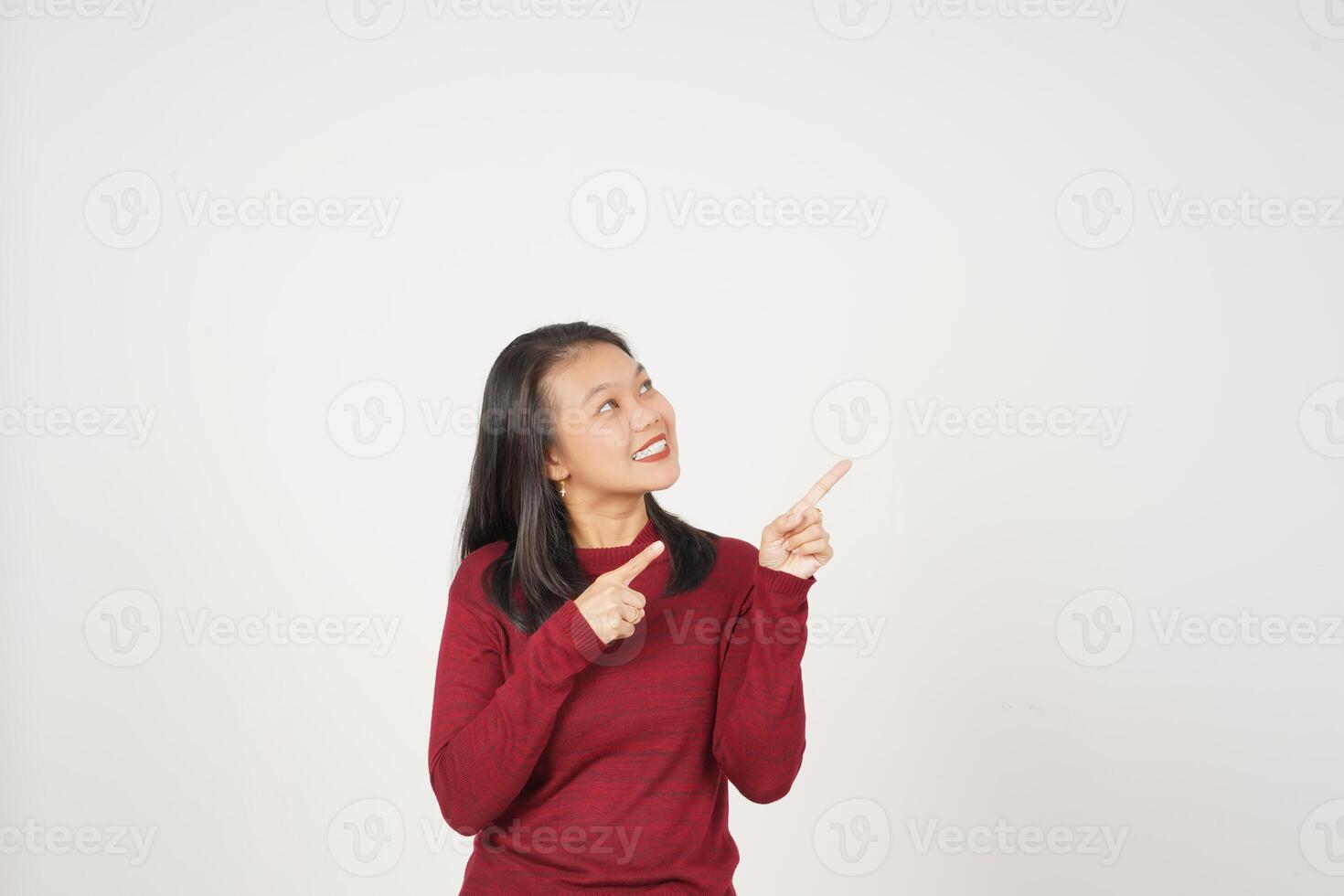 Young Asian woman in Red t-shirt pointing side copy space  isolated on white background photo