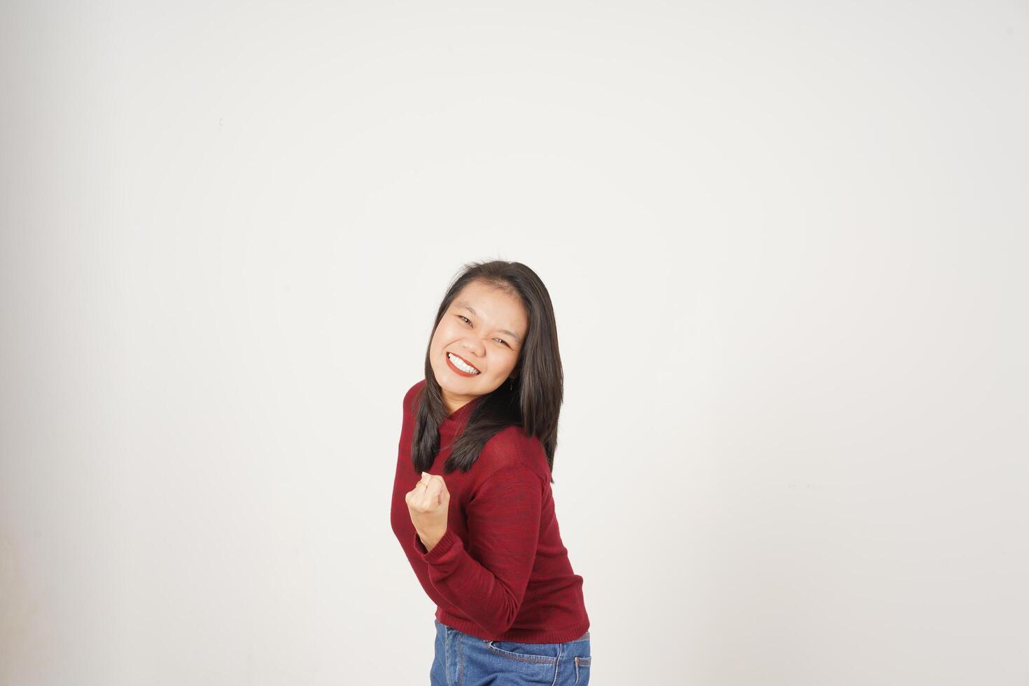 Young Asian woman in Red t-shirt doing yes excited or celebration gesture isolated on white background photo