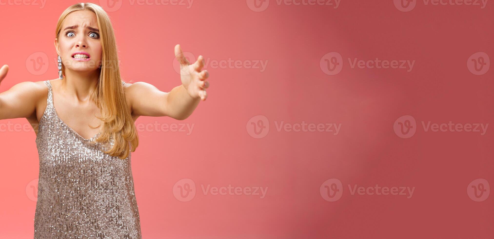 Obsessed ex-girlfriend widen eyes crazy clench teeth stretch hands forward wanna hold tight forever together standing crazy weird red background in silver dress clingy girl want hugs, cuddles photo