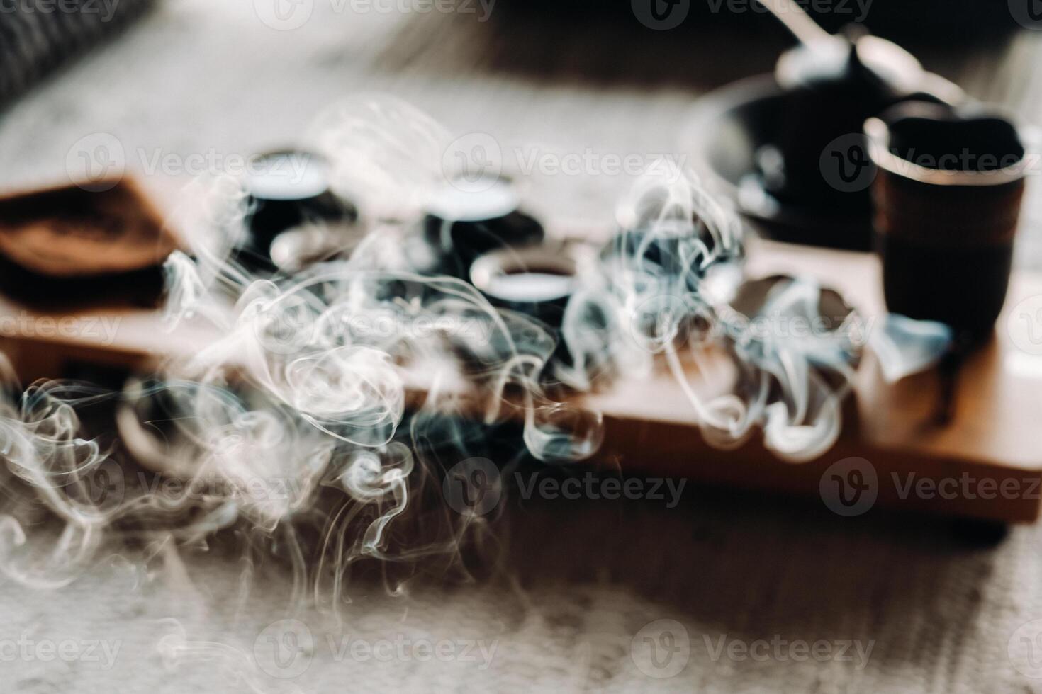 Tea ceremony with smoking incense. Incense stick and tea ceremony photo