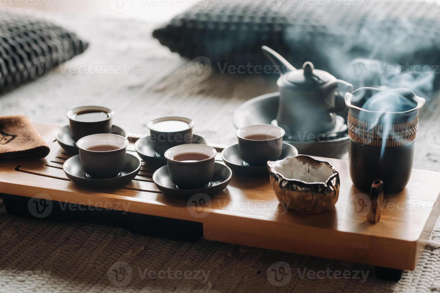 Tea ceremony with smoking incense. Incense stick and tea ceremony photo