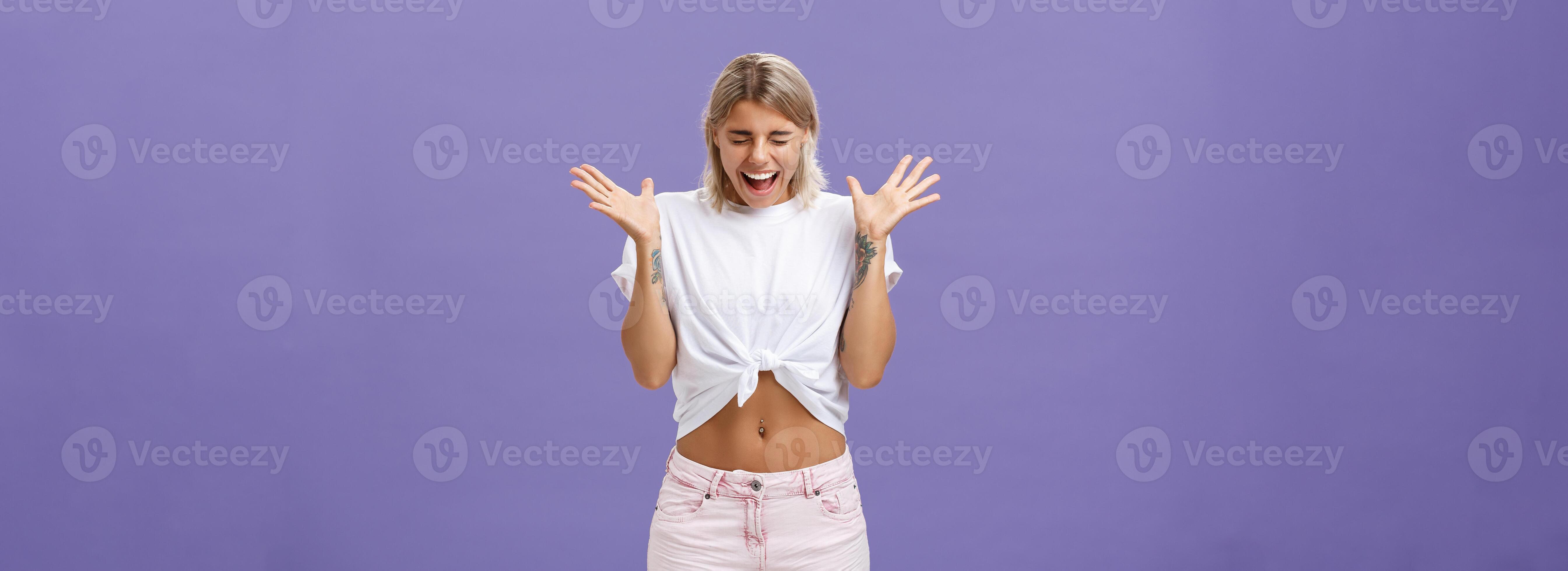 Studio shot of woman having mental breakdown screaming out loud shaking