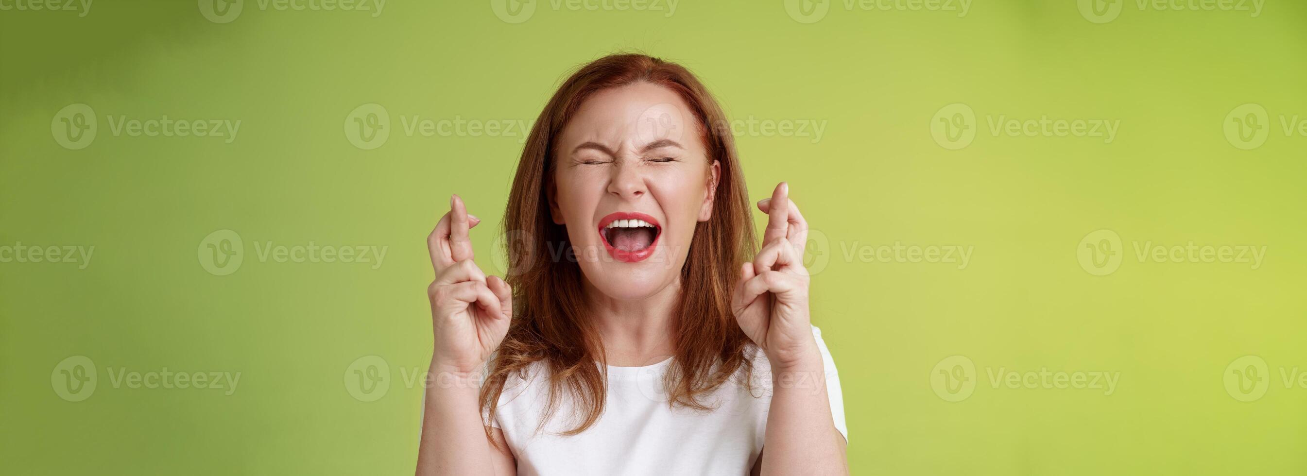Woman implore god protection. Close eyes yelling thrilled cross fingers good luck making wish desire come true hopefully plead lord help belief positive vibe power supplication anticipating results photo