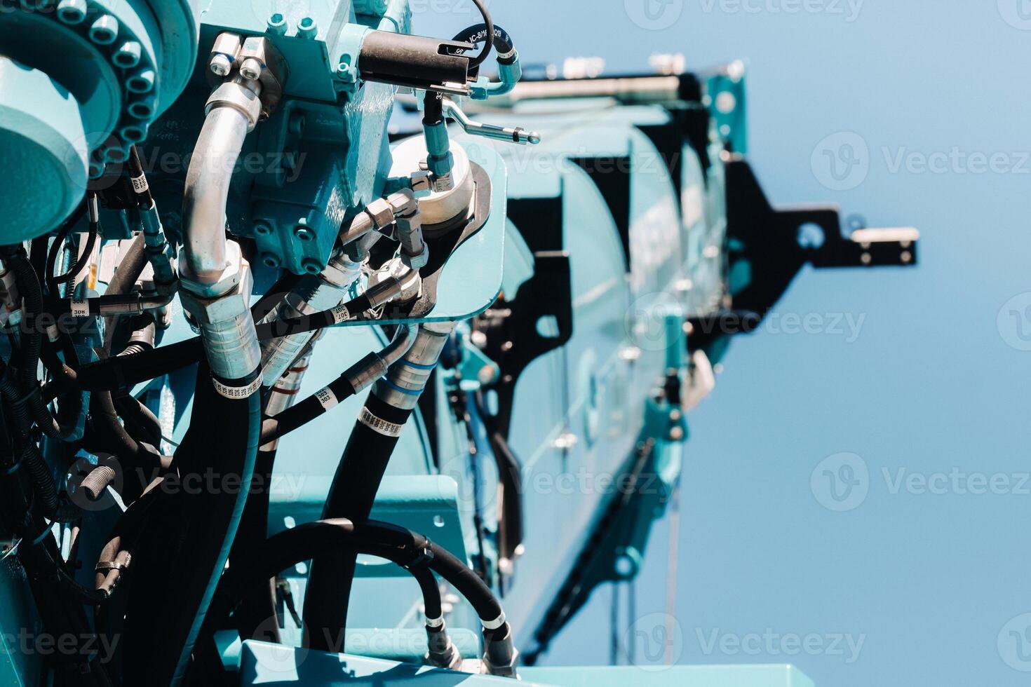 Hydraulic crane engine.The control system of the crane engine.Lifting hydraulic Department on the truck crane.The hydraulic system of the engine.hydraulic hoses on the crane.autoparts photo