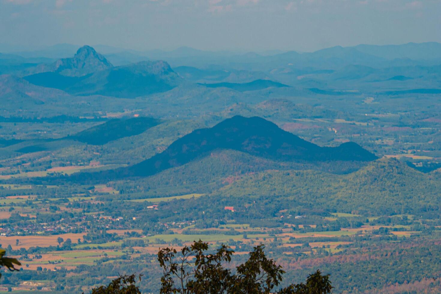 The stunning view in Forest Park from a tourist's standpoint as they go down a hill with background of blue sky, Rainforest, Thailand. Bird's eye view. Aerial view. photo
